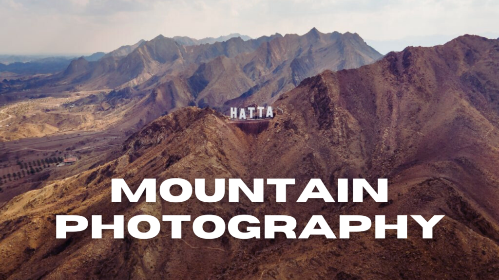 Wide aerial view of the rugged Hatta mountains, ideal for photography and scenic driving.